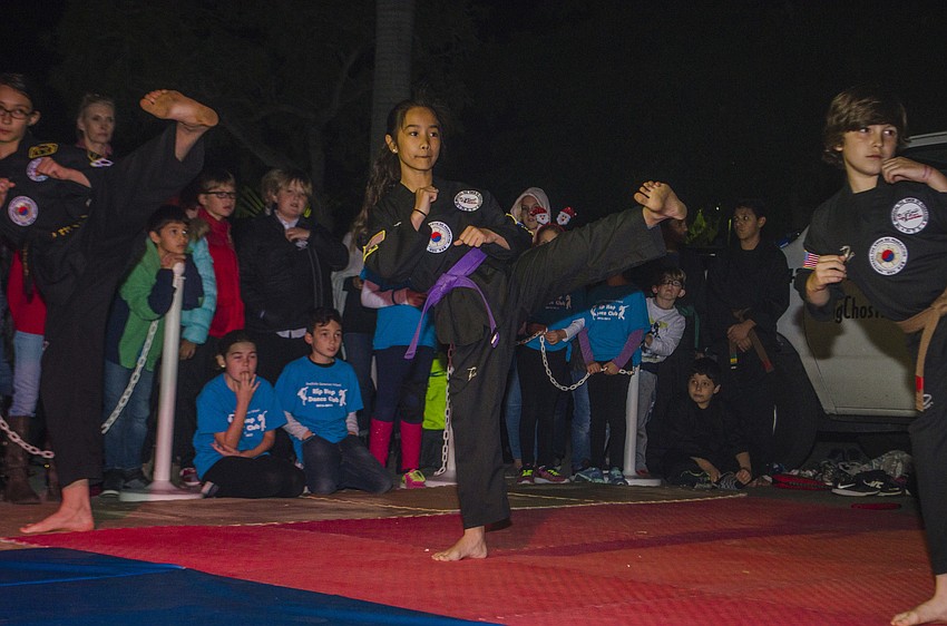 Ayla Edwards performs a Tae Kwon Do routine during the Southside Holiday Stroll.