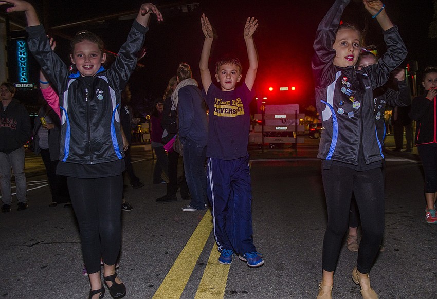 Madie Young, Elie Eschenbach and Senna Deoliverira of Stage Door dance studio warm up before their performance during the Southside Holiday Stroll.