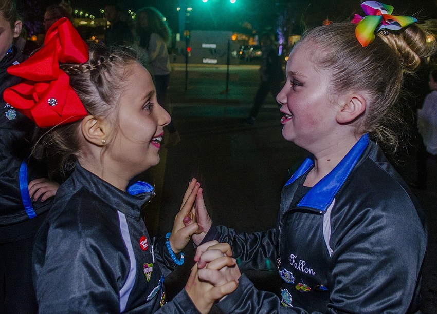 Senna Dioliveira andFallon Rossano practice their routine before their performance at the Southside Holiday Stroll.