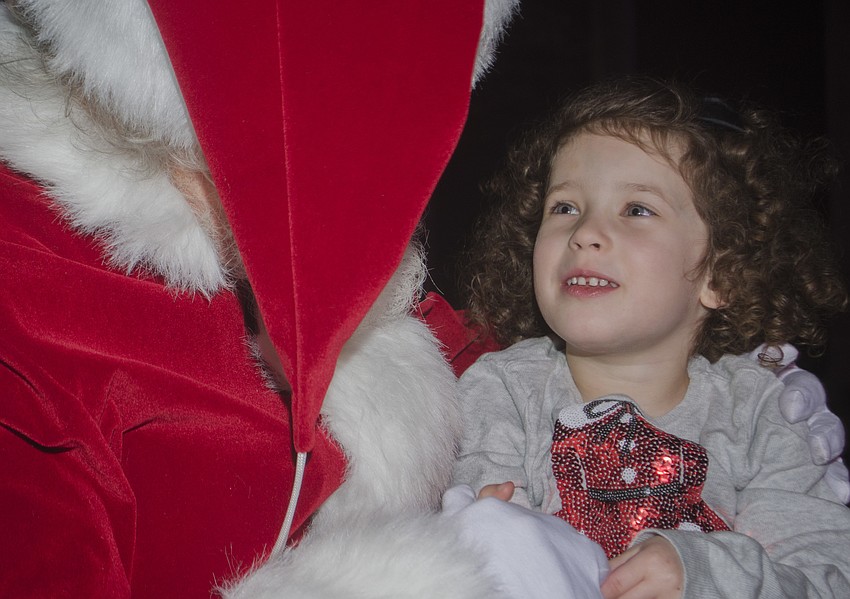 Zara Bermudez tells Santa Claus what she wants for Christmas.