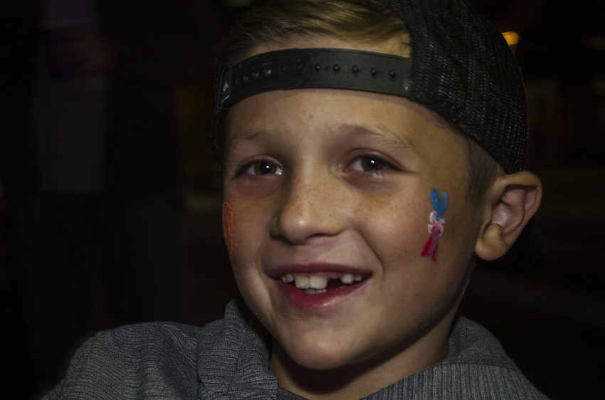 Nicholas Gilham shows off his face paint.