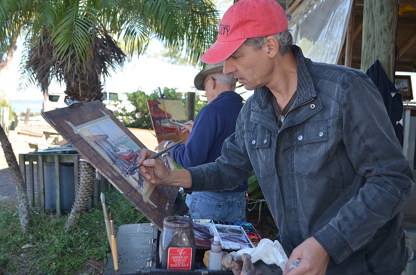 Vlad Yeliseyev paints a scene looking out toward the Sarasota Bay.