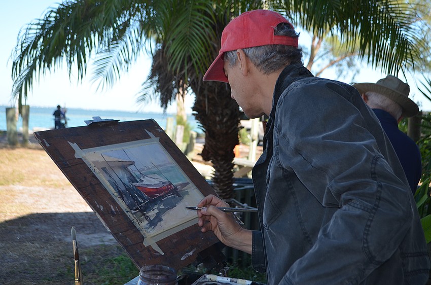 Vlad Yeliseyev paints a scene looking out toward the Sarasota Bay.