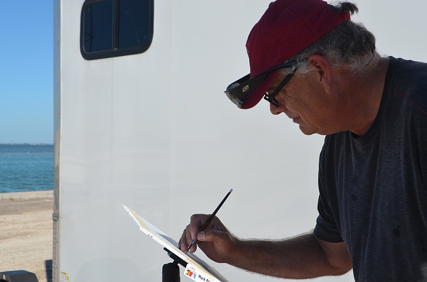 Mark Price concentrates while painting. The SRQ Plein Air painters had two-and-a-half hours to paint a scene around the Sarasota Sailing Squadron.