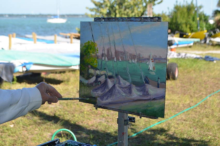 Jane Keeling, a teacher at The Renaissance School of Art, paints covered sailboats.