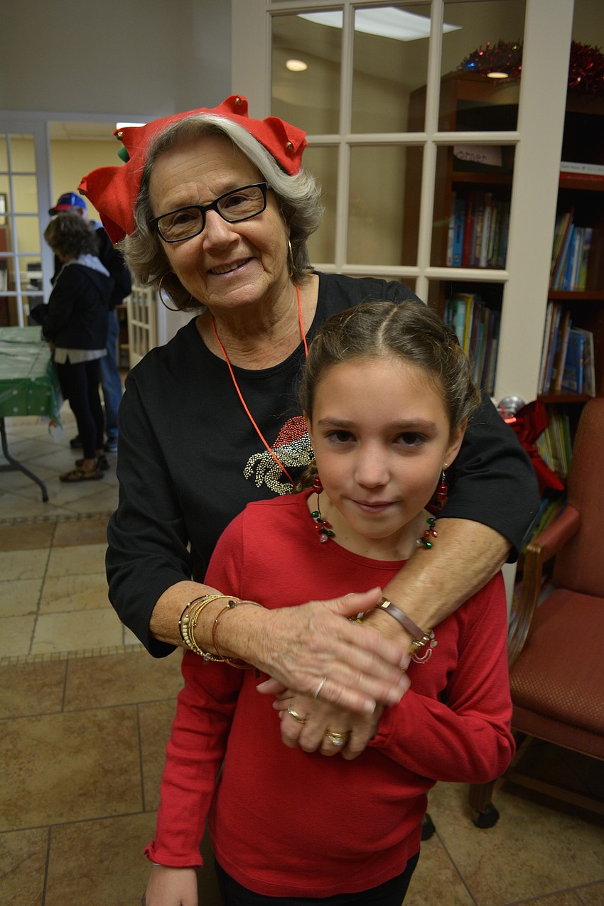 Alya Kozma, 9, gets a hug from her 