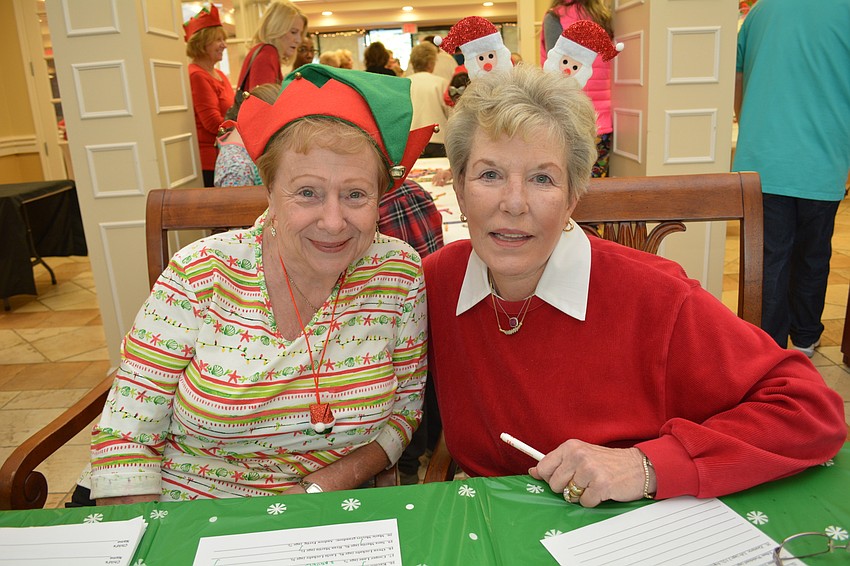 Carol Heeg and Gelene Listro register enjoy the event.