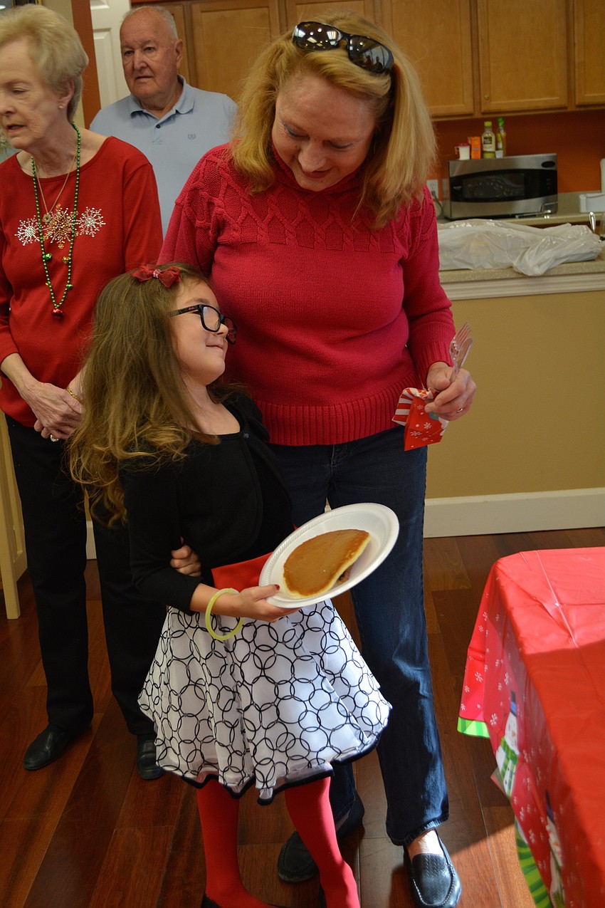 Stoneybrook Homeowners Association manager Anna Kelly brought her granddaughter, Adriana Gallison, of Ruskin.