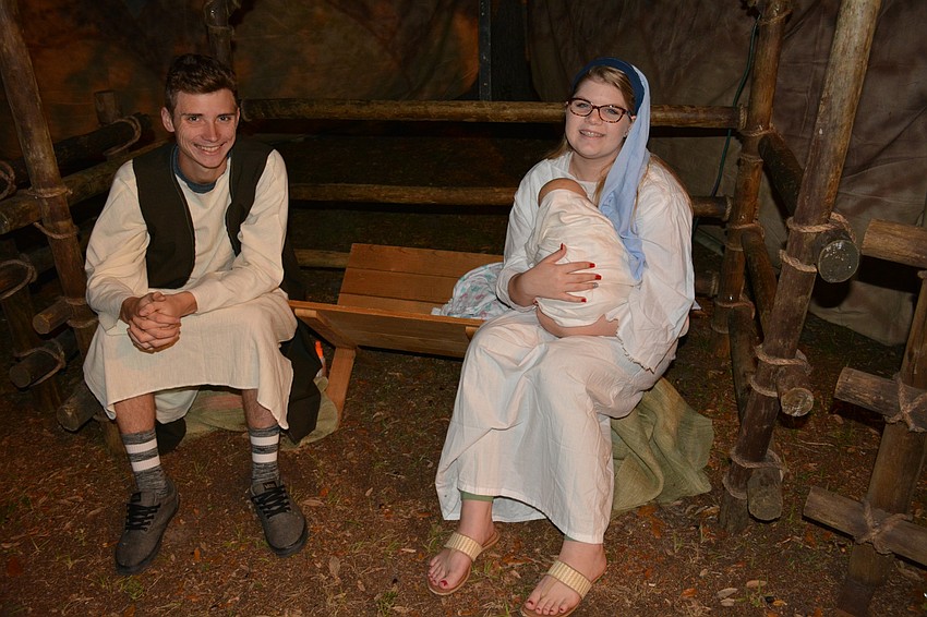 Sarasota' s Daniel Heed joins Braden River High' s Rachel Klosterman in recreating the scene of Jesus'  birth.