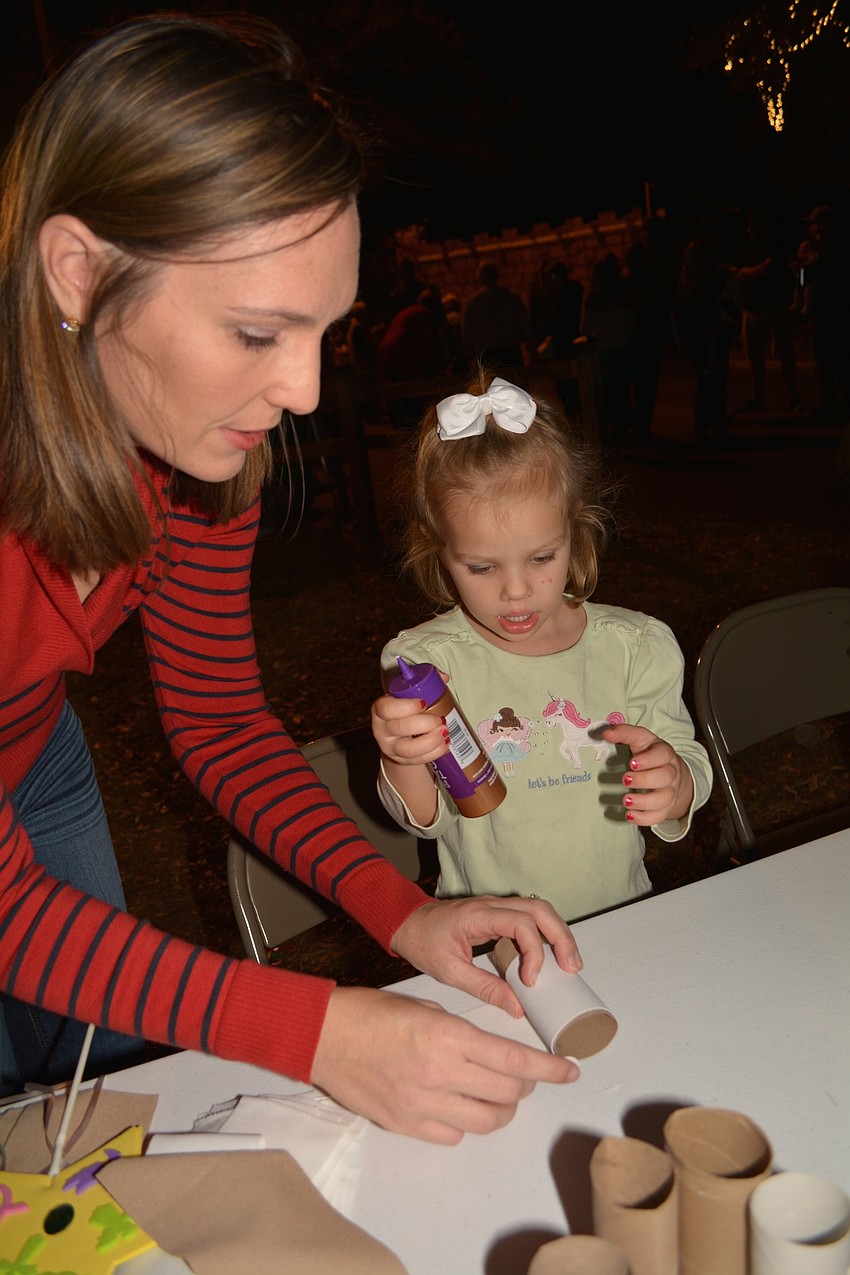 Mill Creek' s Jennifer Otterness helps her daughter, Lauren, 3, make a shepherd.