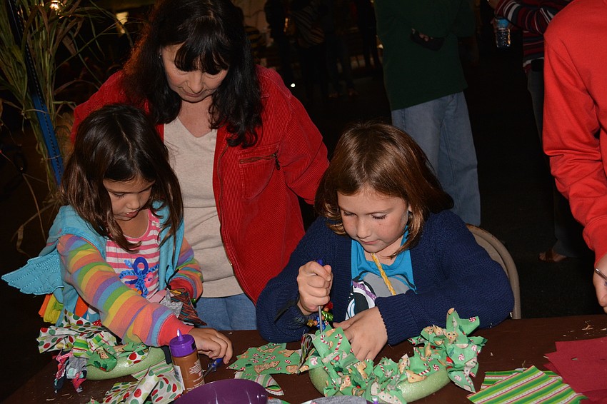 Lynette Deon, center, nannies Mill Creek' s Grace Gerling, left, and Lilly Gerling, right.