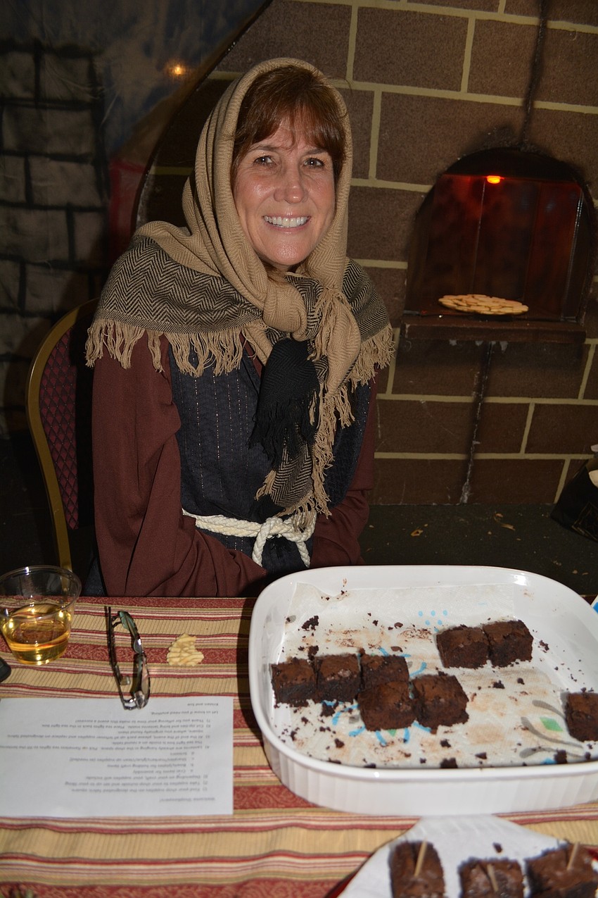 Lori Norgart supplies brownies and cookies to the guests.