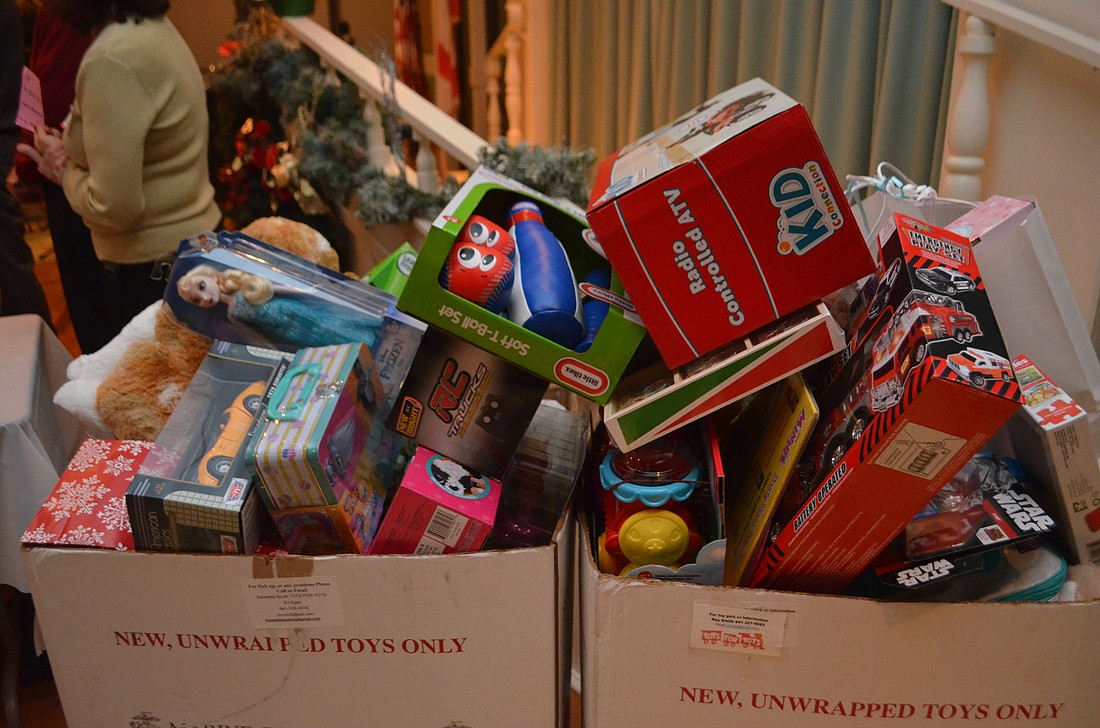 Your Observer Photo Each attendee brought a toy or check to donate