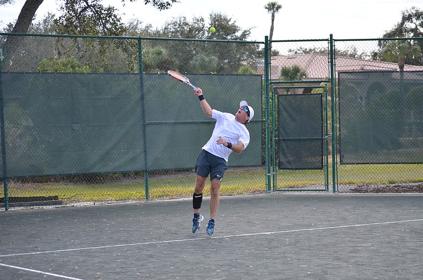 Mark Gilford hits the ball during a preliminary match.