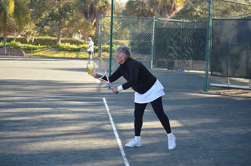 Rita Karns prepares to serve during the division four final match.