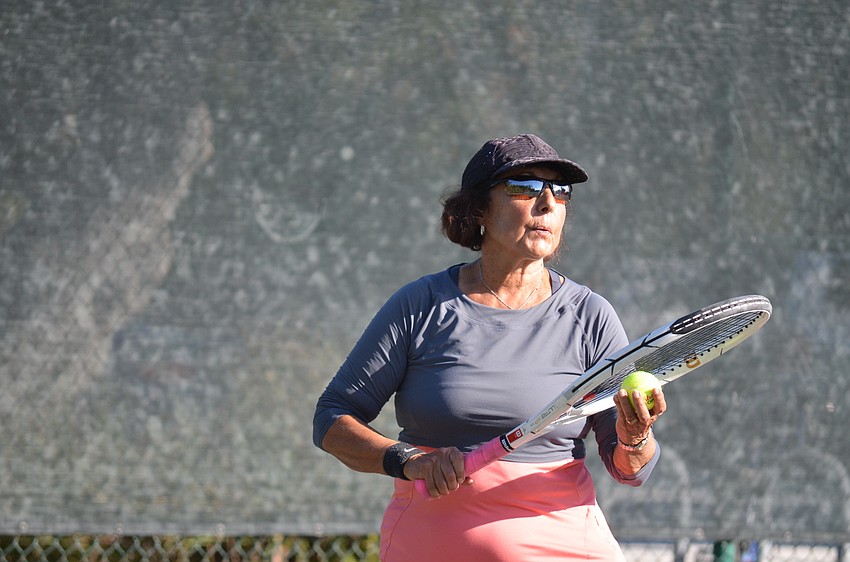 Christine Short prepares to serve during a final match.