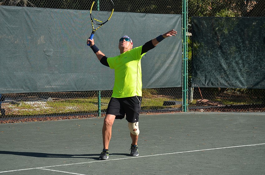 John Beeman serves during the division two final match on Dec. 11.