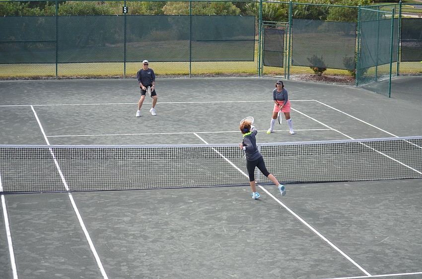 Cathy Kaplinksi defends the net during a final match on Dec. 11.