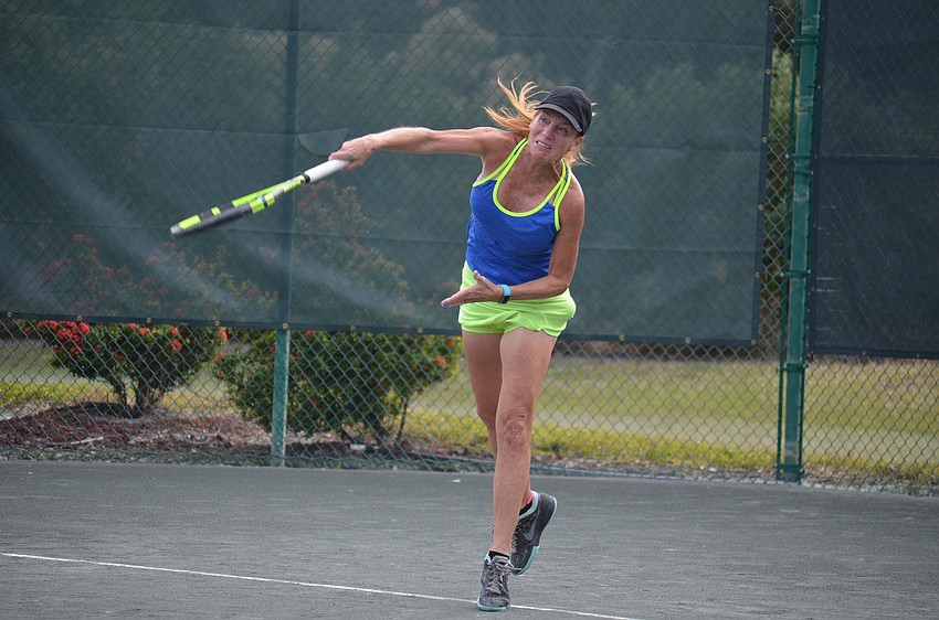 Kate Rhodes serves during the division one final match.