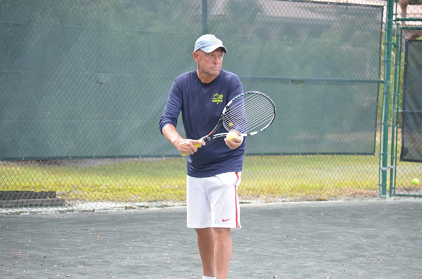 Mark Schloback gets ready to serve during the division one final match.