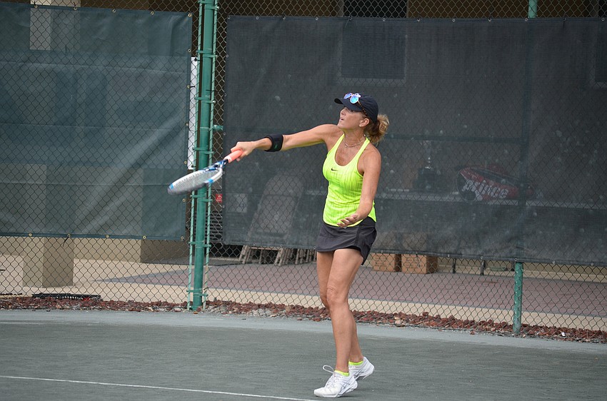 Karen Adams serves during the division one final match.