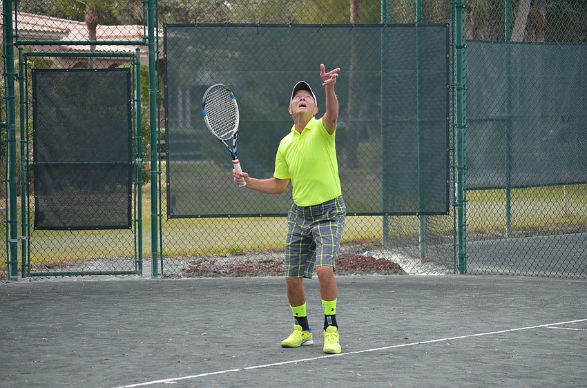Andy Adams serves during the division one final match.