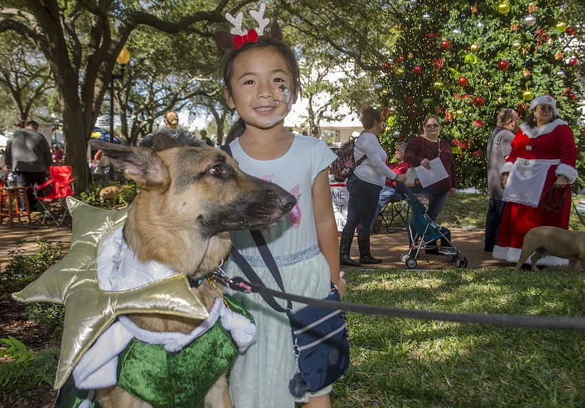 Arden Lee poses with her dog Miko.