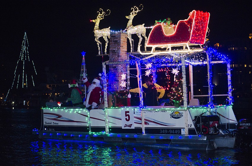 Boats sailed past Marina Jack to end the Boat Parade of Lights.