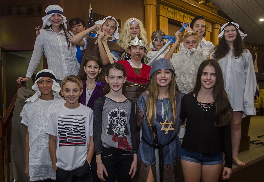 The cast of the play poses after the performance.