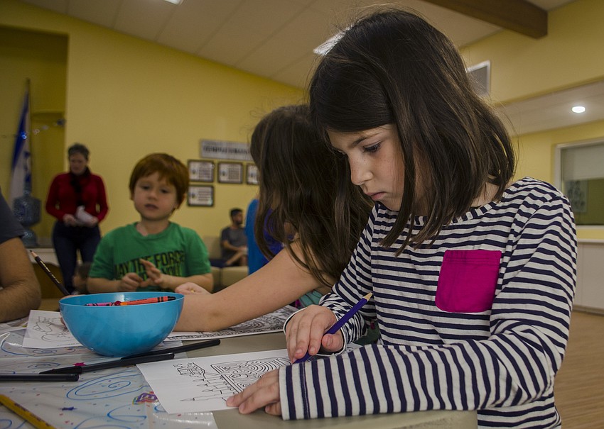 Brooke Feltman colors during the craft portion of the celebration.