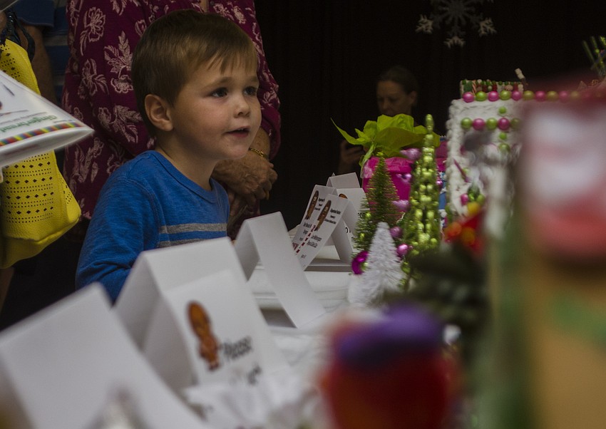 Braydon Grinnell tries to decide which house to vote for in the people’s choice contest.