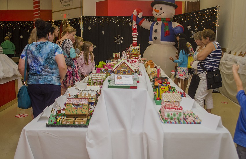 Gingerbread Festival attendees browse the many gingerbread houses.
