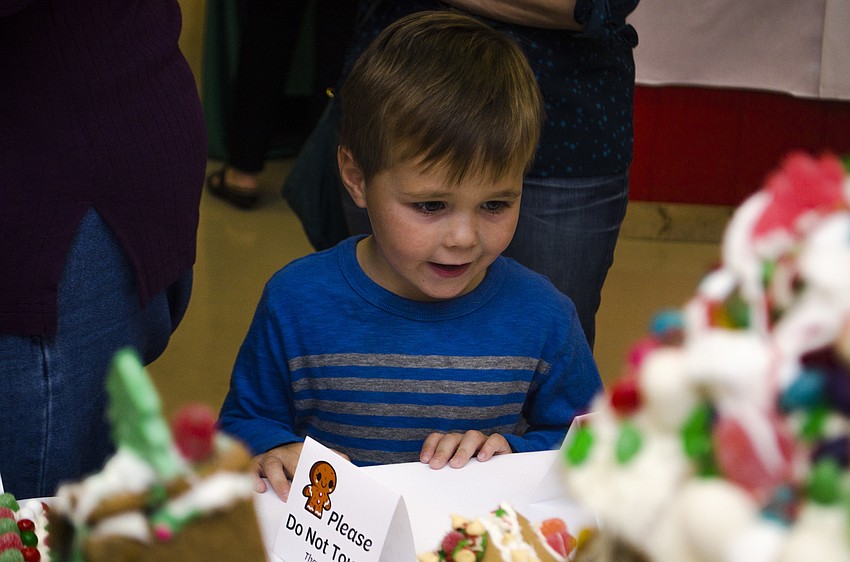 Braydon Grinnell tries to decide which house to vote for in the people’s choice contest.
