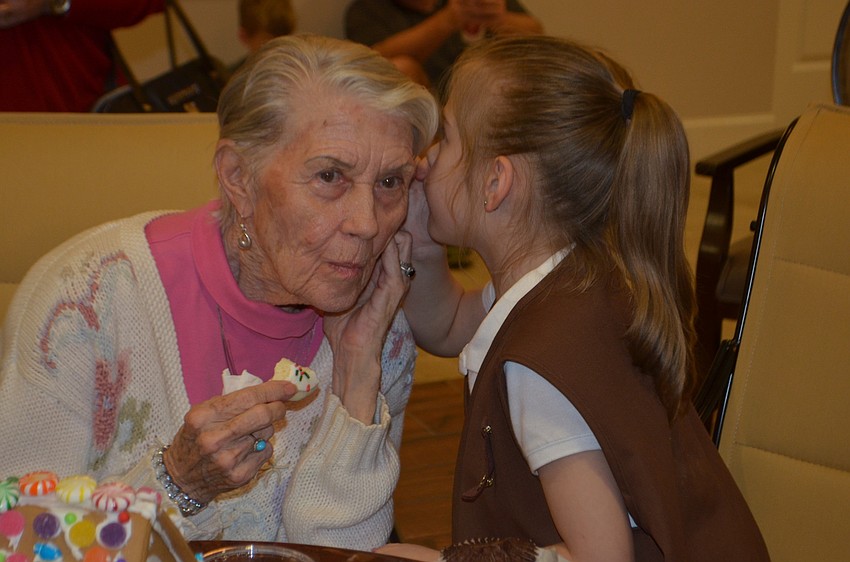 Shirley Knott, an Inspired Living resident, and Parrish'   s Angelica Mendoza exchange secrets over some cookies.