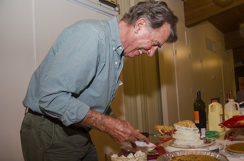 Bill Zoller serves himself some pie.