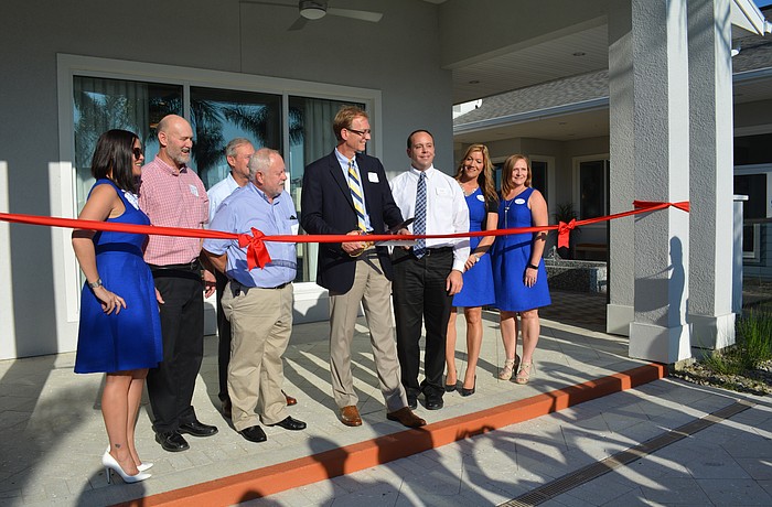 Officials from Zilber, Homes by Towne and Schroeder-Manatee Ranch cut a ceremonial ribbon Dec. 14.