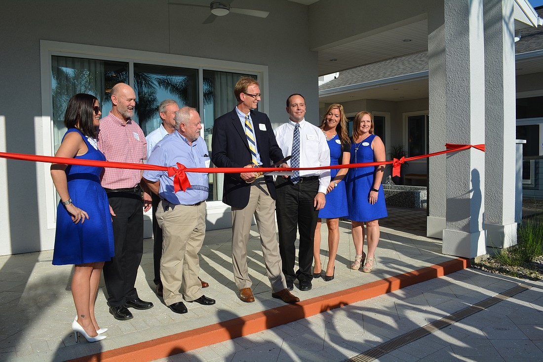 Officials from Zilber, Homes by Towne and Schroeder-Manatee Ranch cut a ceremonial ribbon Dec. 14.