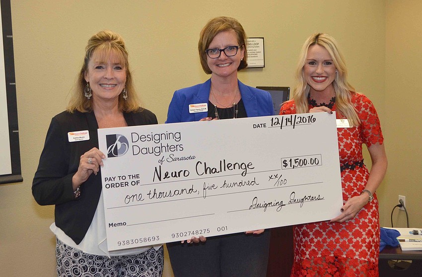 Kathie Muso and Robyn Faucy of Neuro Challenge receive a grant check from Montana Taplinger.