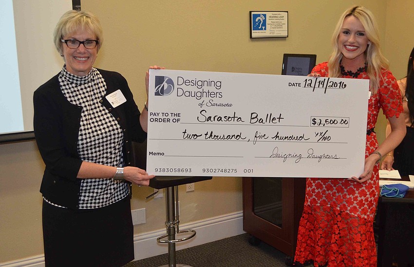 Marjorie Floyd of Sarasota Ballet receives a grant check from Montana Taplinger.