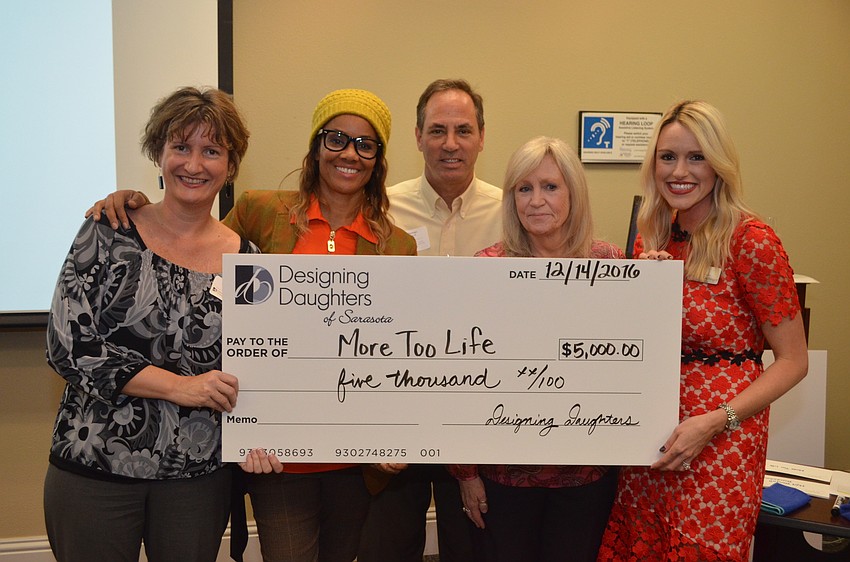 Anne Gaines, Dr. Brook Bello, Jay Berman and Sheila Brion of More Too Life receive a grant check from Montana Taplinger.