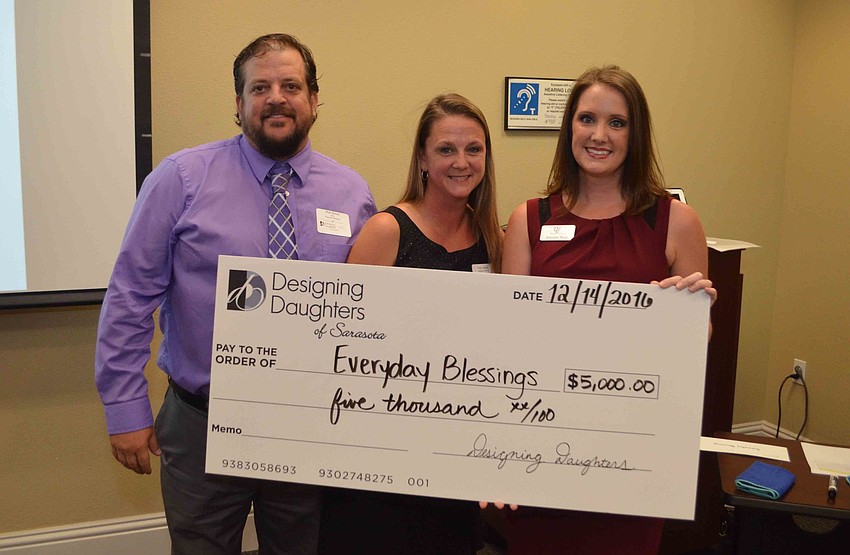 Rich Stroud and Trish Adams of Everyday Blessings receive a grant check from Jen Rust.