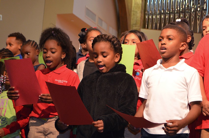 Third graders of 13th Avenue Dream Center of Bradenton sing “Away in a Manger.”