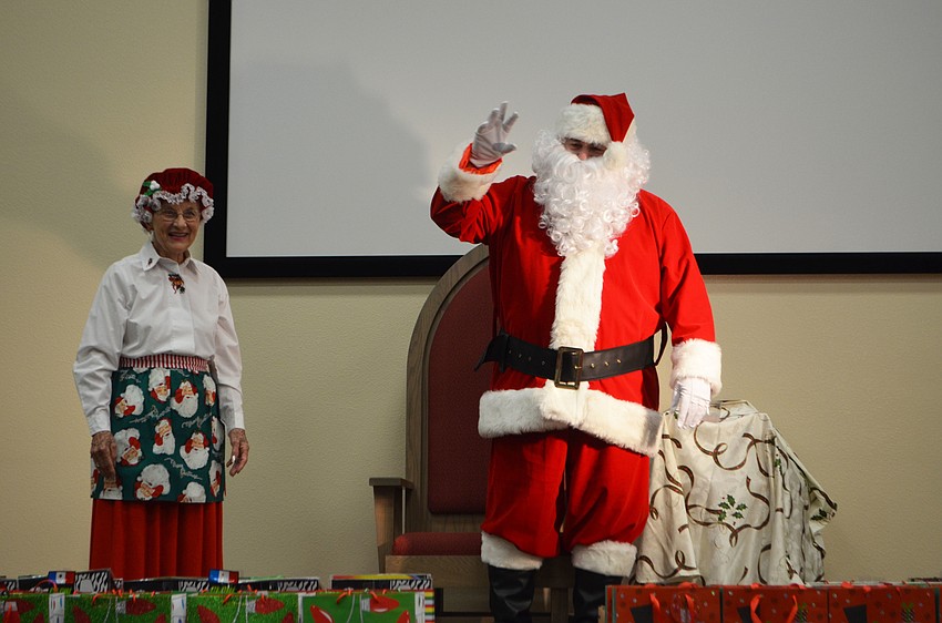 Mrs. Claus and Santa Claus made a special appearance at the party.