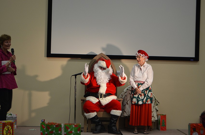 Santa Claus and Mrs. Claus surprised the students of 13th Avenue Dream Center by donating books to the school.