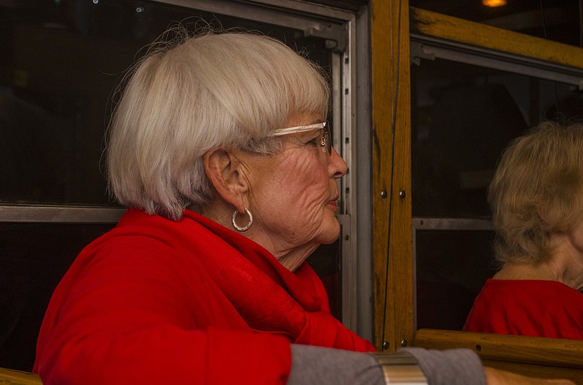 Director of Siesta Key Condominium Council Diane Erne admires the holiday light displays along Beach Road.