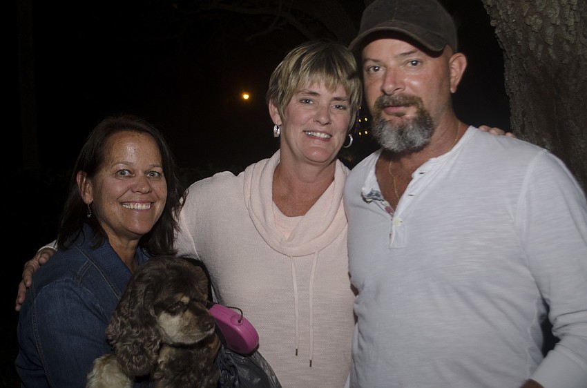 Joan Brown, Jennifer Martin and Andy Martin helped create Bay Tree Club’s light display.