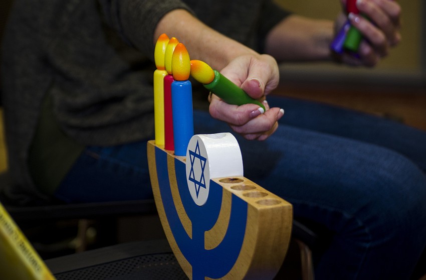 Laura Freedman demonstrated how to light a menorah.