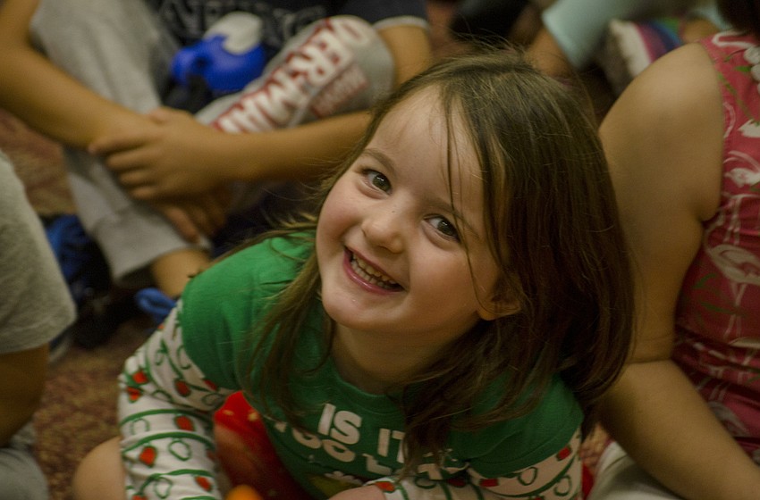 Gabriella Chipurnoi laughs as Laura Freedman reads 