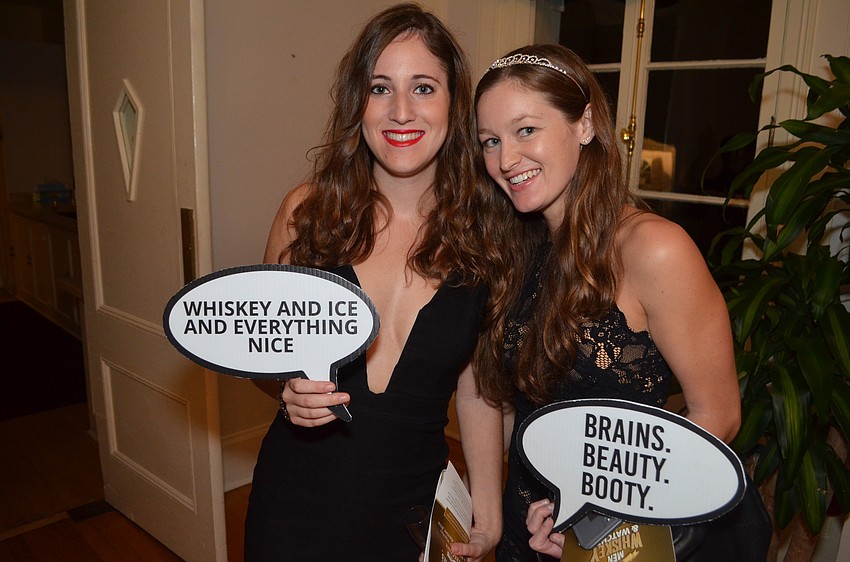 Allison Winokur and Kelly Kane wait their turn for the photobooth.