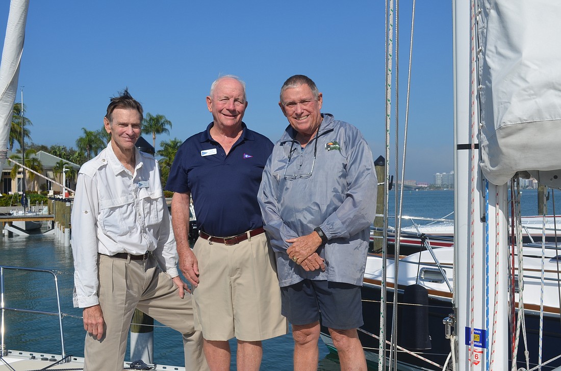 Marvin Quin, Lew Lawrence and Rob Harlan aboard Quinâ€™s 37-foot sailboat at Bird Key Yacht Club.